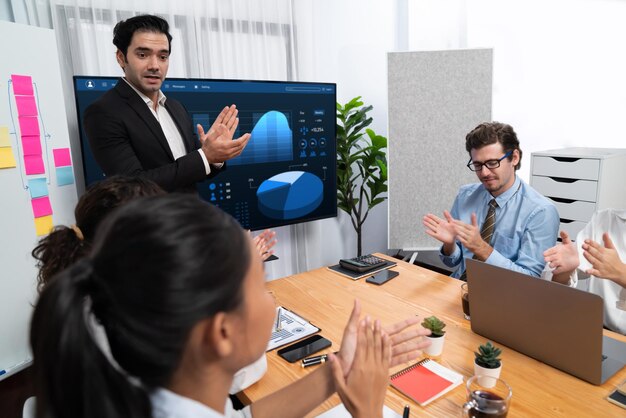 People engaged in discussion with a screen during maritime training